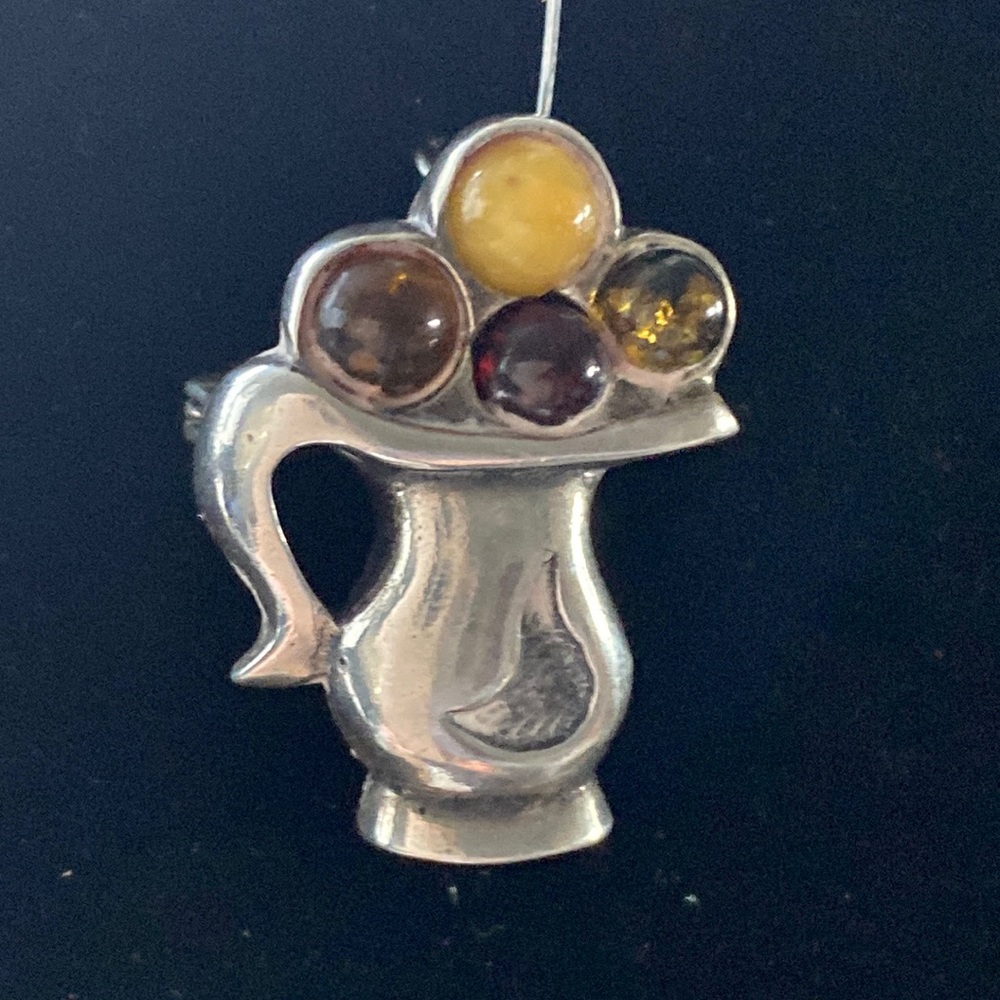Sterling Pendant/Brooch with Multi colored Amber. 1”.  Hallmark on bevel.  $25.